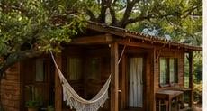 Wooden cabin with hammock