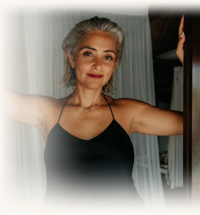 Dimple Amore (Dimple Thakrar), founder of The Dimple Method and host of the Beyond the Words podcast, welcoming at her doorway